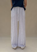 Pantalon large femme en lin blanc à rayures bleues, taille élastique à cordon, jambe ample, vue de face en pied, Dune & Coton — Couleur: Marine